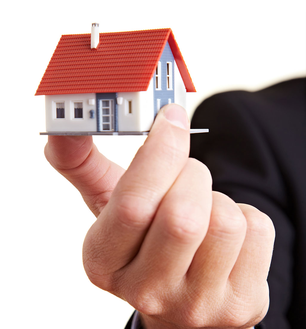 hand mit Haus Vorstellung Inhaber